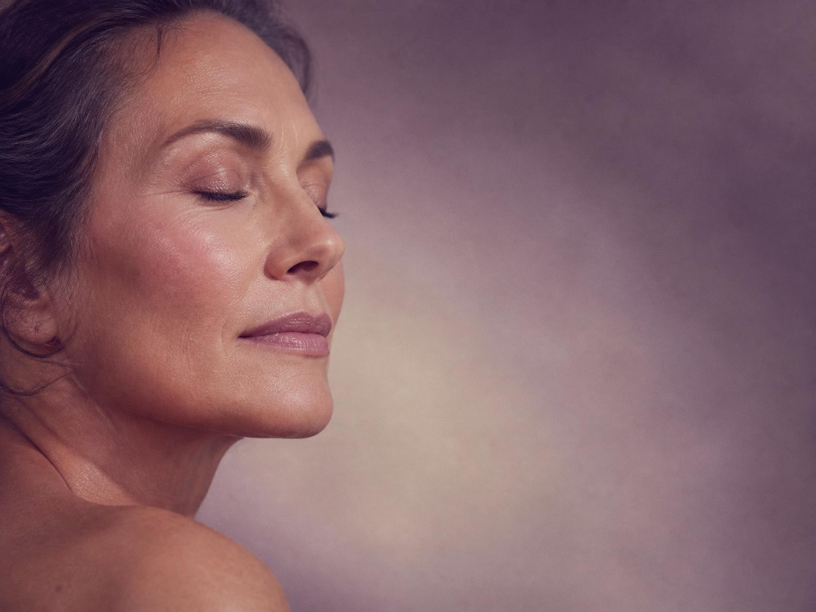 Woman with luminous mature skin in soft profile